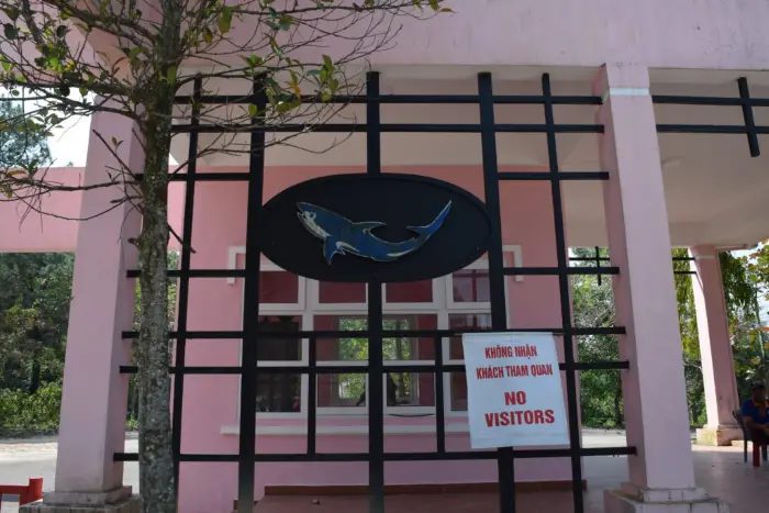 A no visitors sign at the abandoned water park in Hue