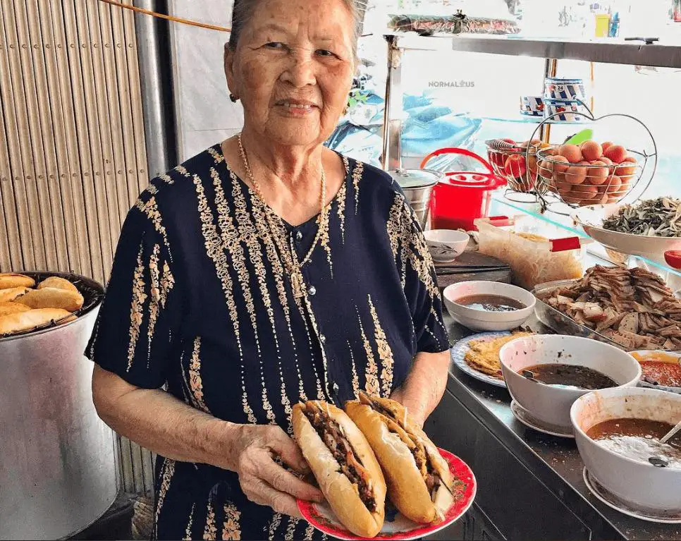 Local woman at her Banh Mi stall